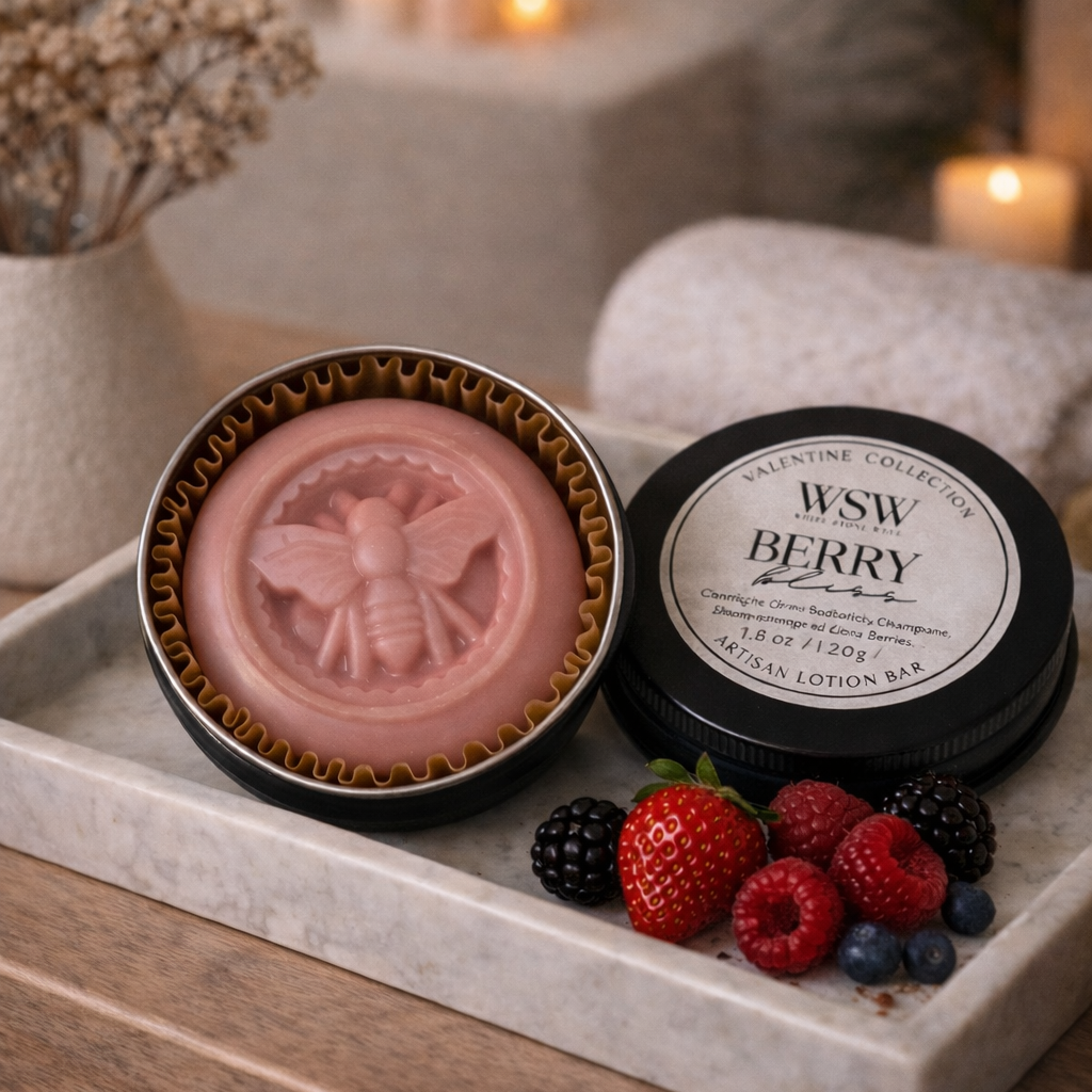 Pink soap in a decorative container with berries on a marble tray